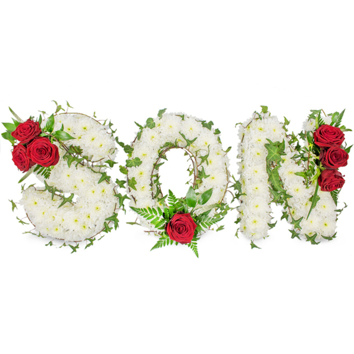A solemn, beautifully crafted memorial arrangement spells 'SON' in three distinct capital letters, each letter sculpted from a dense field of small, pristine white spray chrysanthemums that create a soft, almost cloud-like surface against a stark white backdrop. The chrysanthemums' tight petals form a tactile, carpeted texture that feels comforting and refined, while light-soft and natural-falls across the blooms, picking out their creamy edges and the shadowed valleys between clusters. Interlaced throughout the white masses are trails of glossy green ivy and darker leafy stems which follow the contours of each letter and introduce a sense of organic flow and resilience. Poignant focal points of deep red roses mark each character: three full blooms tucked into the top-left curve of the 'S' with accompanying dark foliage, a solitary, prominent red rose seated at the bottom centre of the 'O' with feathery fern fronds for support, and a vertical cluster of three richly hued roses accenting the right side of the 'N'. The red roses read as intimate punctuation - a visual heartbeat against the calm white field - and together with the ivy suggest enduring love and remembrance. Presented with care by experienced florists who serve the Stanmore area - often requested for funeral services, chapel tributes or graveside placements near Bentley Priory and Stanmore Common - the arrangement balances dignity, crafted detail and emotional clarity, offering families a considered way to express sympathy and honour a son's memory.