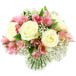 A hand-tied bouquet overflowing with creamy white roses, pink alstroemeria, and clouds of white baby's breath is photographed against a clean white background, its softness and structure perfectly balanced like a carefully composed display in a Stanmore boutique florist. At the core of the arrangement, several white roses open in lush spirals, their petals thick and satin-smooth, curving inward to reveal warm, almost buttery centres that bring a hint of golden light to the bouquet. Between the roses, alstroemeria blooms arc gracefully, each stem carrying several trumpet-shaped flowers in tones that range from pale, petal-pink at the tips to a richer fuchsia closer to the throat. Subtle maroon and rose-red markings streak and spot the inner petals, giving each blossom a unique, painterly pattern. Sprinkled throughout, Gypsophila adds a dreamy, ethereal quality, its tiny white blossoms clustered on fine, branching stems that form a soft veil around the more substantial roses and lilies. Fresh green leaves emerge from beneath and around the flowers, their smooth surfaces and slightly pointed shapes providing a calm, leafy frame that enhances the sense of natural abundance, evoking gardens and tree-lined avenues near Stanmore Country Park. The stems are neatly aligned and firmly tied at the base, suggesting this bouquet is ready to be placed straight into a favourite vase in a Stanmore living room or reception area. The bright, even lighting highlights each petal and leaf, lending clarity and depth to the arrangement. The overall mood is tender and uplifting, making this bouquet suitable for celebrations, heartfelt congratulations, or a thoughtful sympathy gesture sent to loved ones across Stanmore and surrounding neighbourhoods.