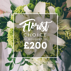 From the moment it enters the room, this Florist Choice bouquet from Flowers Stanmore radiates refined intimacy. White lilies rise with regal clarity, their petals softly curved, while lime-green clusters add a contemporary pulse-perhaps Green Trick dianthus or compact hydrangea-to keep the arrangement bright and current. The surrounding whites, including ranunculus or spray roses, lend volume and satin texture, and deep green foliage such as eucalyptus and ruscus threads through the stems to ground the design. The bouquet appears hand-tied, as if the florist balanced each bloom with quiet confidence, making it comfortable to hold for a bride, partner, or thoughtful gift to mark a milestone in Stanmore. The softly blurred backdrop hints at a wedding or formal moment in nearby streets like Canons Park or Belmont. In the center, a white rectangular frame overlays the image, with Florist Choice at the top, BOUQUET in uppercase beneath, and a bold price displayed at the bottom, signaling premium quality yet approachable value. Delivered for same-day or next-day service across Stanmore and surrounding towns, this bouquet represents Flowers Stanmore's craft, reliability, and commitment to freshness.