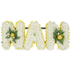 A tender floral tribute composed to honour a cherished grandmother, the arrangement spells out the letters "MAM" in three freestanding capitals, each densely covered in small, immaculate white chrysanthemum sprays that create a soft, cloud-like surface. The composition is edged all the way round with a bright, pleated yellow satin ribbon, its sunny tone crisply framing each letter and catching the light like a warm ribbon of memory. At the leftmost 'M' and the rightmost 'M' delicate accent clusters are placed with intent: a centrally furled yellow rosebud anchors each cluster, surrounded by fragrant white freesia or similar tiny white buds and a selection of deep green, glossy leaves and slender fern fronds that lend texture and a verdant freshness. A discreet dark green or black horizontal rail runs behind the upper portions of the letters, unseen from the front but providing secure support for display on a chapel stand, grave easel or service table. In soft daylight the chrysanthemums' immaculate whites and the ribbon's vivid yellow read as a quiet conversation between purity and warmth; the freesia and rose add a gentle perfume that feels familiar and comforting. As a Stanmore florist I think of arranging this for families gathering near Stanmore Hill, Bentley Priory or Marsh Lane, where its understated elegance and comforting tones help tell stories of gentle laughter and afternoons shared. Flowers Stanmore can prepare and deliver this personalised sympathy design locally with a careful, respectful hand.