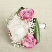 Inspired by the tranquil elegance of Stanmore's leafy avenues, this bouquet is a vision of pure romance and sophistication. Three radiant pink roses, their petals lovingly flushed from vibrant magenta to gentle lavender, rest amidst a billowing nest of white peonies with the softness of fresh morning clouds. Intertwined within, baby's breath offers a scattering of tiny, white blossoms, lending the bouquet a gentle, fairy-tale quality and an air of innocence. Glossy, deep green foliage encircles the blooms, folding neatly to frame and accentuate the arrangement with an eye-catching vibrancy. A sleek white satin ribbon envelops the stems, forming a classic handle ready for cherished moments-be it a wedding at Stanmore Country Park or a heartfelt celebration with loved ones. The soft, natural light gliding across the bouquet highlights every undulating petal and crisp fold, enhancing the rich textures and subtle scent that evoke a fresh spring morning after rain. Set against a neutral fabric background that brings forth the flowers' colour and artistry, this bouquet is an embodiment of love and refined beauty, crafted with the signature touch and care familiar to Flowers Stanmore and its community.