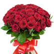 Set against a flawless white background, this majestic bouquet commands attention with its cluster of approximately fifty to sixty rich red roses-each boasting perfectly layered, velvety petals that seem to glow with life. Arranged in a domed, abundant form, the roses transition from tightly closed buds to fully open blossoms, showcasing the full spectrum of passionate crimson hues. Glossy, dark green leaves weave between the flowers, lending texture and emphasizing the vibrant red of each bloom. At the base, strong stems are smartly bound with a generous, satin-finish red ribbon, tied into a dramatic bow whose flowing ends complete the ensemble with an artistic flourish. This arrangement captures the inimitable romance and grandeur associated with Stanmore, evoking memories of celebrations along Canons Drive or special evenings near Bentley Priory. The bouquet's splendour, from the interplay of light on petals to the soft tactile luxury of each stem, makes it the ultimate declaration of love, a classic gift for anniversaries and significant occasions-a signature creation by Stanmore's own local florists, ready to elevate life's most meaningful moments with their artistry.