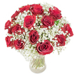 A timeless, romantic bouquet of roughly 18-20 deep crimson roses, each bloom fully opened to reveal velvety, spiralled petals, nestles amid a halo of frothy white baby's breath (Gypsophila paniculata) that drifts like mist between and around the roses. Arranged as a lush, domed cluster, the flowers sit in a clear glass vase so that the long, green stems are visible through the water, adding a vertical rhythm and a hint of natural freshness to the rounded silhouette. The composition is photographed against a crisp white background with soft, even light that lifts the glossy sheen from each petal and makes the tiny, cloud-like gypsophila blossoms glimmer like powdered sugar. Tactile contrasts are clear in the image: the dense, velvety weight of the crimson roses versus the feather-light, almost translucent sprigs of baby's breath that soften the overall effect and lend an airy, nostalgic quality. A subtle floral perfume seems almost audible from the description-the warm, heady scent of classic red roses tempered by the faint, sweet breath of gypsophila-creating a sensory scene of quiet celebration. The arrangement reads as a small ceremony of affection, perfect for anniversaries, Valentine's gestures, or a heartfelt surprise that aims to convey deep love and devotion. As a local florist familiar with Stanmore's quieter corners-places like Stanmore Broadway and the calm of Bentley Priory-I picture this bouquet crossing a doorstep as an intimate, considered gift that speaks directly to the heart without fuss or pretense.