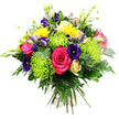 Against a smooth white background, this densely packed, round bouquet seems to glow with vivid colour and careful craftsmanship. A large hot pink rose opens at the centre, its full, velvety petals unfolding in generous layers, providing a bold, romantic focal point. Clustered around it are whimsical lime green spider chrysanthemums, their long, slender petals splaying out in airy, spiky textures that add movement and a bright chartreuse zing. Deep indigo and violet lisianthus flowers weave in and out of the design; some are fully open with softly ruffled edges, while others remain in sleek buds, offering the promise of new blossoms over the coming days in a Stanmore living room or hallway. Dots of bright yellow from button-like chrysanthemums or petite gerbera blooms scatter warmth through the bouquet, echoing sunny afternoons in the open spaces around Stanmore. Elegant freesia in creamy white or pale yellow rise delicately above the main cluster, their tiny bell-shaped flowers lining slender stems that suggest a subtle, fresh fragrance. Tucked between the more dramatic flowers are hints of smaller pale pink or peach roses or spray roses, adding gentle, romantic notes that soften the palette. A rich mixture of foliage - glossy dark leaves, slender stems, and feathery fern fronds - forms a deep green backdrop that frames and intensifies the brighter colours. The stems are clearly gathered by hand at the base, indicating a classic hand-tied style suited to placement in a favourite vase after local delivery. The overall effect is lush, cheerful, and uplifting, the sort of bouquet that would be chosen to celebrate promotions, birthdays, or heartfelt thank-yous across the Stanmore area.