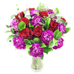 A lush, rounded bouquet of deep crimson roses and vivid magenta-purple carnations is artfully gathered in a simple clear glass vase, photographed against a crisp white background. The roses range from tight spirals to gently unfurling blooms, their velvety petals catching a soft, natural light that suggests a cool, early-morning glow. Intermixed are abundant ruffled carnations, their frilly edges and almost fuchsia tones creating lively contrast and a tactile, almost feathered texture. Bright, glossy greens - likely ruscus - form a full, verdant base, while long, silvery-green eucalyptus sprigs weave through the composition, introducing airy movement and a modern, slightly herbal scent note to the classic blend. The stems are visible through the transparent vase, lending a fresh, botanical honesty to the design and emphasizing the care taken in stem placement to support a dense, balanced dome. The overall mood is celebratory yet intimate: a bouquet that reads as romantic and confident, ideal for anniversaries, heartfelt congratulations, or a vivid pick-me-up for someone special. I picture this arrangement on a dining table in a Stanmore home or delivered with care from a local florist to brighten a flat near Stanmore High Street or a cosy house by Stanmore Common. The combination of deep warmth from the roses and bright, whimsical carnations creates a touchable, uplifting presence, and the eucalyptus adds a whisper of modernity that keeps the composition fresh and relevant for both traditional and contemporary interiors.