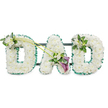 A beautifully composed DAD funeral floral tribute dominates this image, the letters arranged in a neat row and standing out clearly against a clean white background. Each of the three letters is formed from a dense covering of pristine white chrysanthemums, their compact blooms pressed closely together to create an even, cushion-like surface. The petals appear soft and slightly feathery at the edges, giving the arrangement a gentle, comforting texture that speaks of peace and tender remembrance. Around the outside of every letter runs a ruffled emerald green satin ribbon, its rich colour and subtle sheen providing clear definition and a fresh contrast to the white flowers. Small glimpses of a dark framework and connecting bars can be seen from behind, indicating that the tribute is mounted on a sturdy base so it can stand upright during a service at a Stanmore chapel or graveside gathering.
Carefully placed accent sprays add character and emotional detail. On the first D, at the upper left, a small cluster of white freesia blooms and glossy green leaves softens the edge and introduces the suggestion of fragrance and natural movement, as though a small garden had been tucked into the letter. From this cluster, two long, slender green stems arc gracefully across the tribute towards the middle, guiding the eye towards the A. At their crossing point, near the lower part of the A, sits a striking yet tasteful focal arrangement: two deep purple calla lilies emerge from a nest of white freesia and foliage. Their sculpted, trumpet-like forms and rich hue provide a deeper, more contemplative note to the composition, symbolising profound love and sorrow. The final D carries a smaller, echoing cluster of freesia and greenery on its upper right side, balancing the first spray and completing the design. Together, these details create a serene, heartfelt memorial piece, the sort of bespoke DAD tribute many Stanmore families might choose to honour the memory of a much-loved father.