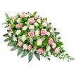 A beautifully composed casket spray in soft pink and white is displayed against a stark white background, allowing every nuance of the design to stand out. The arrangement follows a teardrop shape, broader and more rounded at the upper left and tapering elegantly to a fine point at the lower right. At the centre, clusters of pink roses-ranging from the palest blush to deeper rose tones-unfurl their velvety petals in gentle spirals, evoking tenderness and affection. Nestled between these roses are white carnations and smaller spray carnations, whose densely packed, ruffled petals form a cloud-like layer that brightens the entire composition. The flowers are supported by a generous bed of foliage: broad, glossy dark green leaves provide a solid, grounding frame, while rounded eucalyptus leaves in a muted, silvery green weave throughout, bringing visual softness and a suggestion of cool, calming fragrance. From the tapered end of the spray, fine trails of dark green ruscus or similar foliage cascade, lending a sense of motion and a graceful finishing touch, as if the arrangement is gently flowing forward. The overall mood is quiet and reverent, yet not heavy; the colours and textures work together to create a feeling of comfort and remembrance. It is the kind of tribute often chosen for funerals and memorial services around Stanmore, where families wish to express their love and respect in a way that feels both dignified and deeply personal. Each petal and leaf appears carefully placed, reflecting a thoughtful farewell and a lasting message of peace.