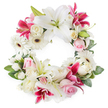 A dignified open circular wreath of sympathy flowers is shown against a pure white background, its ring packed with blossoms in calming shades of white, soft pink, and intense magenta. Large white lilies appear throughout the design, their smooth petals spreading wide and slightly curling at the tips, revealing light green pistils and golden stamens that give each flower a luminous centre. Interspersed with these are rich deep pink and fuchsia lilies, star-shaped and lightly speckled, which introduce a bolder, more dramatic note while remaining respectful and balanced. Nestled between the lilies are soft pink roses, some held in tight buds and others gently opening to reveal their layered, velvety petals, adding a sense of tenderness and affection. Creamy white roses, many in full bloom, contribute traditional elegance and help to round out the wreath's lush, full profile. Bright white gerbera daisies with dark central eyes punctuate the arrangement, offering a fresh, contemporary element and a pleasing contrast in texture. Smaller white filler flowers-perhaps miniature carnations or spray roses-are tucked into the spaces between larger blooms, ensuring the circle feels seamless and complete. Around the outer edge, a collar of deep green foliage and mixed leaves creates a natural frame, adding depth and softening the overall silhouette. The result is a beautifully balanced memorial wreath that conveys peace, remembrance, and enduring love, well-suited for delivery to services and homes throughout Stanmore, from the quiet residential streets near the station to gatherings close to Stanmore Country Park, offering a gentle floral tribute during moments of loss.