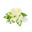 Against a clean, luminous white backdrop sits a pristine boutonnière or wrist corsage conceived for a wedding or other formal occasion, its quiet elegance defined by a large, creamy white rose at the center. The rose's many layers of petals are tightly furled at the heart and unfurl outward in soft, velvety waves, catching gentle highlights that reveal subtle depth and a cool, tactile softness. Below and around the rose a small cluster of white freesia blossoms opens with slender, trumpet-like petals, while a couple of elongated yellow-green freesia buds reach upward, suggesting the promise of further bloom. Narrow, deep-green leaves and slender foliage cradle the flowers, their glossy surfaces offering a vivid contrast that makes the whites appear even purer. Tucked among the stems are tiny daisy-like blooms with pale yellow centres, lending a delicate, country-garden charm and intricate texture at close range. To the right, a neat cluster of lustrous white pearls nestles into the arrangement, their smooth, reflective surfaces echoing traditional bridal jewellery and adding a whisper of sparkle without overpowering the flowers. Soft, diffused studio light washes the composition, creating mild shadows that emphasise petal layers and the arrangement's three-dimensional form. The overall mood is one of restrained refinement and tender anticipation-a corsage that would sit comfortably on a groom's lapel or a mother-of-the-bride's wrist. Local touches-imagining this piece collected on Stanmore High Street or worn for a celebration near Canons Park-help place the floral story in the neighbourhood, where classic whites and gentle textures are often chosen to mark milestone moments with quiet, confident beauty.