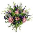 This hand-tied bouquet reads like a breezy Stanmore meadow gathered at first light: soft antique-pink roses - some tightly cupped, others gently unfurling to reveal slightly deeper pink edges - form the romantic centre. Alongside them, full mauve-pink carnations offer ruffled, velvety texture while slender spires of deep indigo veronica lift the composition with vertical drama. Small, starry aster-like blooms in pale lavender-blue, each with a tiny yellow eye, scatter like confetti, and rich purple lisianthus punctuate the arrangement with jewel-toned depth. Silvery, rounded eucalyptus leaves cradle the flowers, their cool matte sheen balancing the warm pastels, and bright lime-green clusters of textural filler - reminiscent of Santini or viburnum - nestle between stems to give a fresh, dewy contrast. The stems are visible and gathered at the base, clearly hand-tied by an experienced florist, and the whole bouquet is lit as if by soft morning sun, enhancing the pastel tones and whispering a faint green, floral perfume. There's an unforced, loose structure to the design that feels as if it were picked from a private garden near Stanmore Common and placed on a kitchen table on Marsh Lane or Stanmore Broadway. This arrangement suits quiet celebrations, a thoughtful thank-you, or a simple gesture to brighten a local neighbour's day, offering an approachable elegance that never feels contrived. It invites the recipient to breathe in its subtle scent and linger over the layered textures and colours long after the flowers have been admired.