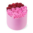 An elegant and vibrant statement from Flowers Stanmore, this rose box is presented in a soft pastel pink velvet cylindrical hatbox, set against a pristine white background. The hatbox invites touch with its plush, fabric-soft texture, its slim cylinder giving the bouquet vertical grace. Within, dozens of roses are neatly arranged to fill the brim, their heads fully opened and perfuming the air with a subtle, sweet fragrance. The arrangement is deliberately divided into two colour zones: the upper arc features roughly a dozen deep crimson red roses, tracing a curved line that suggests a heart or a deliberate design cue; the lower portion is awash with bright fuchsia pink roses, creating a warm, electric counterpoint. The quality of the petals, the symmetry of the spacing, and the clean product-shot presentation speak to premium craftsmanship and long-lasting bloom life. This design is equally at home as a romantic gift for Valentine's Day or anniversaries or as a luxurious centrepiece for a stylish living room. In Stanmore and the surrounding Harrow neighbourhoods, Flowers Stanmore offers same-day delivery to nearby streets like Stanmore High Street, Canons Park, and Edgware Road, ensuring the moment arrives on time. The bouquet embodies romance, celebration, and refined taste, a celebration of floral artistry that can brighten intimate moments or grand gestures.