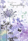 The design of this sympathy card is like a calm breath, similar to standing on a peaceful street in Stanmore just as the light begins to soften in the evening. Airy silhouettes of wildflowers rise from the base, their thin stems elegantly bending as they reach toward an unseen sky. Each umbel-shaped flower head is detailed yet delicate, painted in shades of lavender, indigo, and soft blue, with touches of pale green and silvery tones that glimmer subtly against the paper. Some petals and tiny florets seem to drift away at the edges, blending into the softly layered background of violet and powder blue, creating a dreamlike sense of depth. Butterflies are scattered gently among the blooms, their wings only lightly defined, as if caught mid-flight in a soft breeze. They bring a hint of transformation and continued presence, a visual whisper that love remains even when someone is no longer physically here. The overall palette is cool but comforting, carefully balanced so that no single element overwhelms another. In simple, graceful lettering, a message of sympathy sits above or beside the floral silhouettes, its curves echoing the natural lines below. For those in Stanmore choosing a card to accompany condolence flowers, this design feels quietly reassuring. It does not shy away from the tenderness of loss; instead, it wraps that emotion in calm colour and gentle form, offering a respectful embrace through its thoughtful, nature-based imagery.