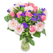 This bouquet possesses a graceful poetry, pairing soft pink roses and pale gerbera daisies that glow gently against a backdrop of deep green leaves-much like the tranquil green spaces scattered across Stanmore. Each rose delicately unfurls, its pastel hue catching the afternoon light, evoking heartfelt appreciation or the excitement of new beginnings near Bentley Priory. Among the soft blooms, clusters of vivid violet statice peek through, their lively colour and subtle, papery texture offering a playful, spontaneous note-reminiscent of laughter shared at Stanmore's local cafés. The overall composition feels open yet abundant, as if gathered on a peaceful walk through Bernays Park. Placed in a slender glass vase, this arrangement is the very embodiment of joyful intentions-a lovely choice for birthdays, congratulations, or sending affection when words are not enough. Each flower is chosen for both its beauty and its message, ensuring that every recipient feels truly valued and connected to the care at the heart of Stanmore's floristry.